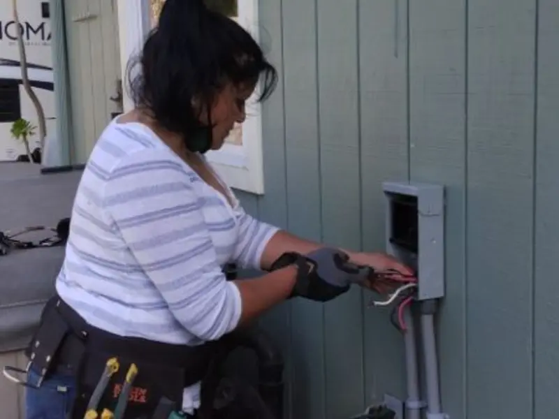 Licensed electrician wiring an exterior subpanel in Wood Dale