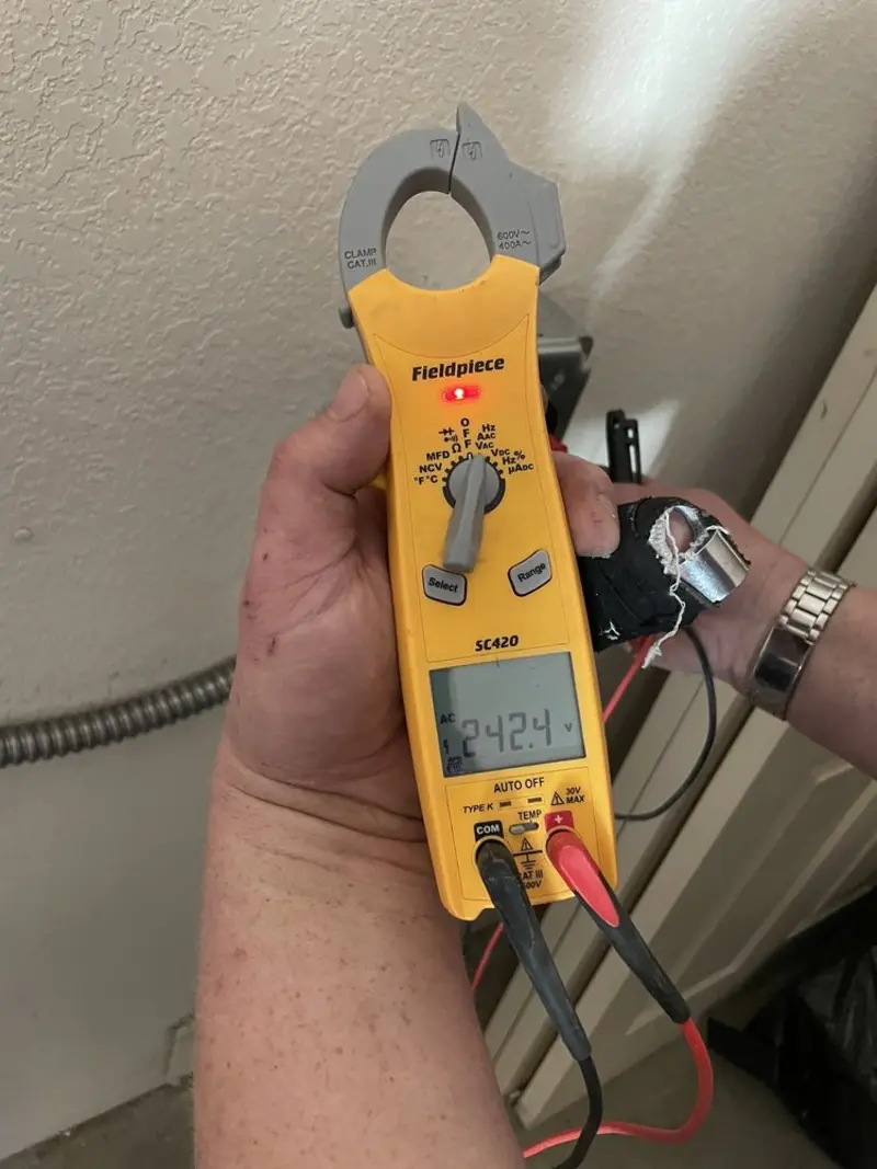 Voltage testing with clamp meter during Generator Installation in Wood Dale